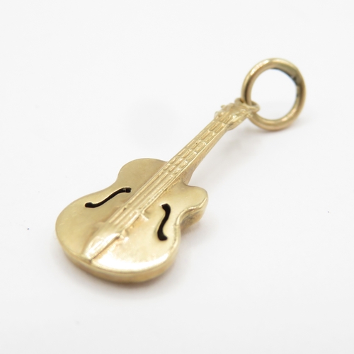 122 - 2 x 9ct gold charms - cat and guitar (1.8g)