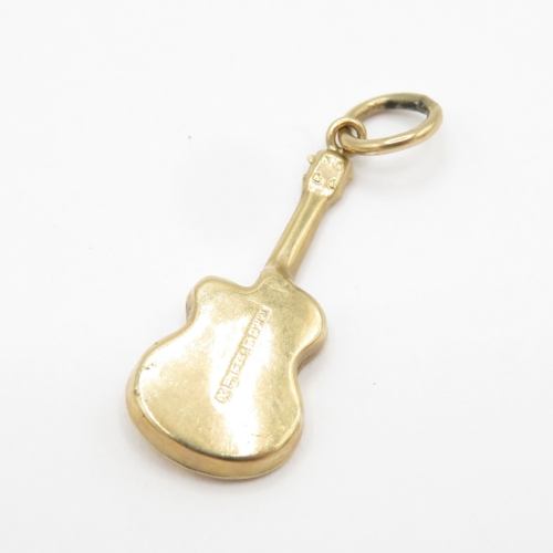 122 - 2 x 9ct gold charms - cat and guitar (1.8g)