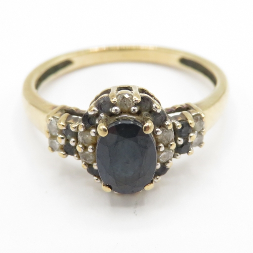 127 - 9ct gold sapphire and diamond halo ring  (2.4g) Size O