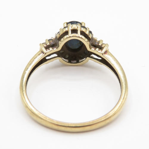 127 - 9ct gold sapphire and diamond halo ring  (2.4g) Size O