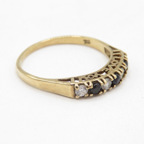 13 - 9ct gold sapphire and white gemstone channel set ring  (1.6g) Size N