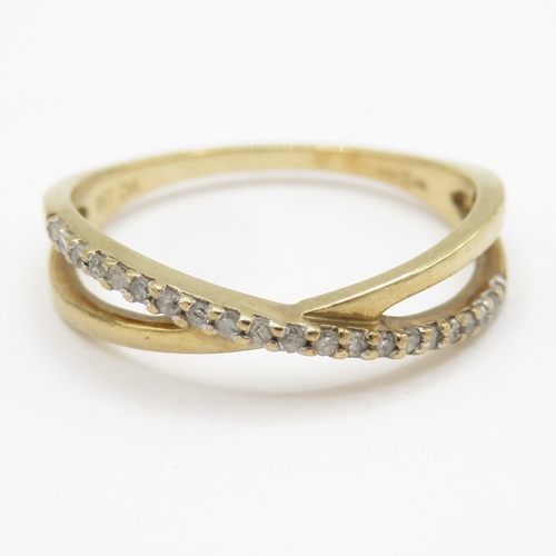 143 - 9ct gold diamond crossover ring  (1.3g) Size J 1/2