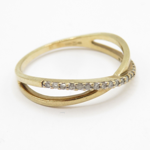 143 - 9ct gold diamond crossover ring  (1.3g) Size J 1/2