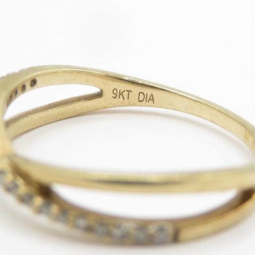 143 - 9ct gold diamond crossover ring  (1.3g) Size J 1/2