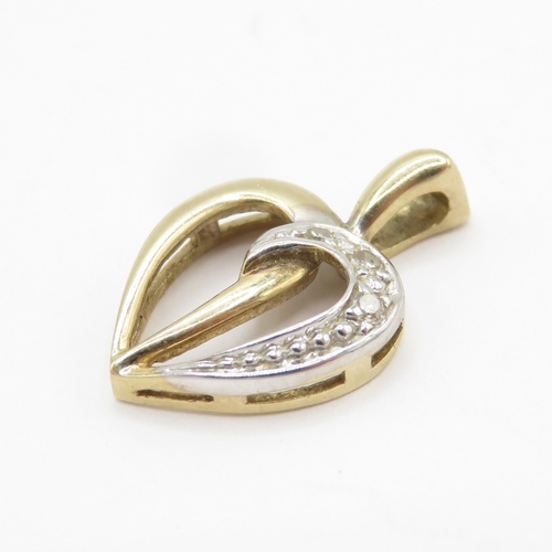 144 - 9ct gold diamond heart pendant (0.9g)
