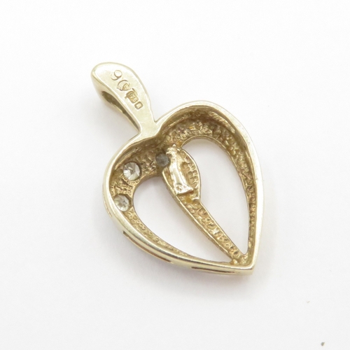 144 - 9ct gold diamond heart pendant (0.9g)