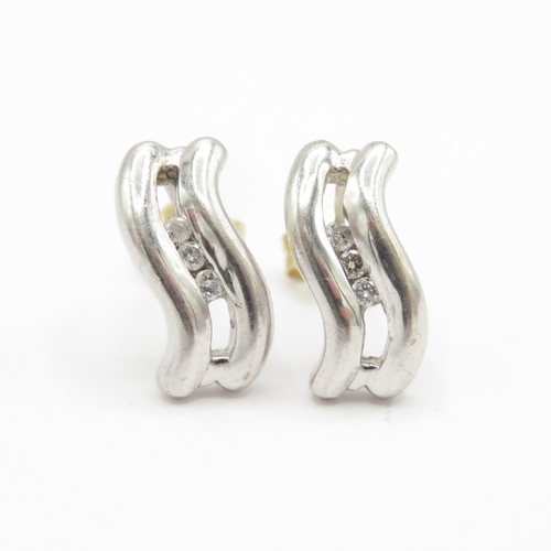 147 - 9ct white gold diamond earrings with yellow gold backs (2g)