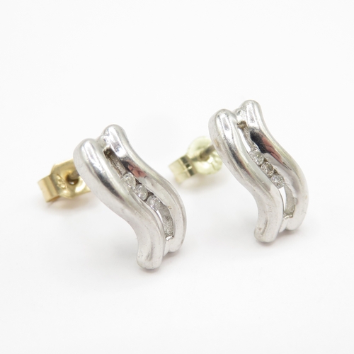 147 - 9ct white gold diamond earrings with yellow gold backs (2g)