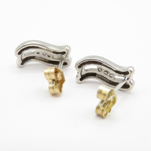 147 - 9ct white gold diamond earrings with yellow gold backs (2g)