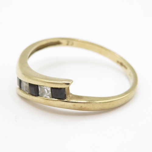 154 - 9ct gold topaz and white gemstone bypass ring (1.6g) Size N