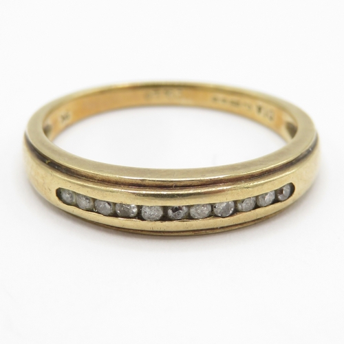 157 - 9ct gold diamond channel set ring (2.4g) Size M 1/2