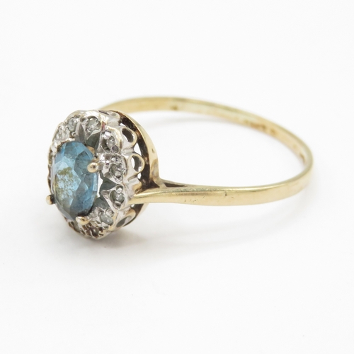 72 - 9ct gold topaz and diamond halo ring  (2.1g) Size W