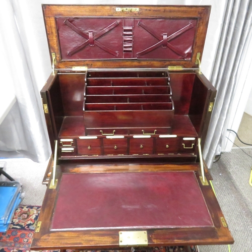 280 - A gentleman's compendium with lock stand and has front opening with campaign handles.  In good condi... 