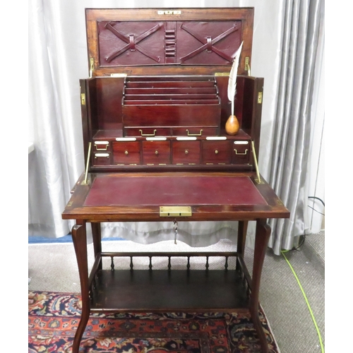 280 - A gentleman's compendium with lock stand and has front opening with campaign handles.  In good condi... 