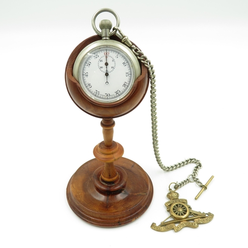 287 - Non silver pocket watch and chain with stand. Watch runs