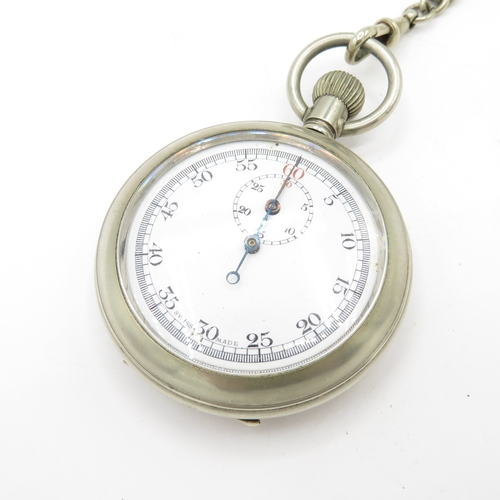 287 - Non silver pocket watch and chain with stand. Watch runs