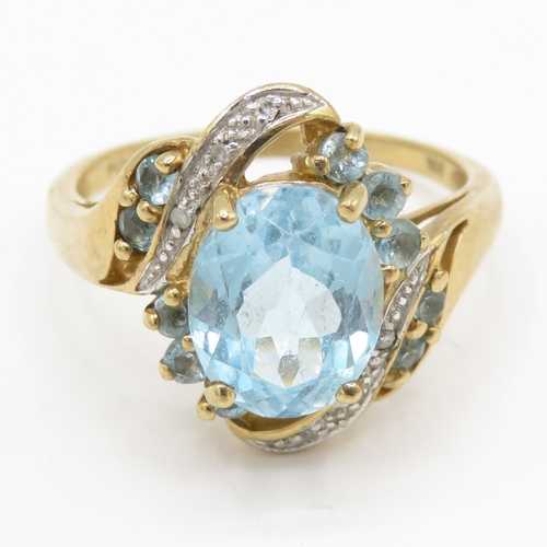 155 - 9ct gold topaz diamond cluster bypass ring (4.1g) Size P