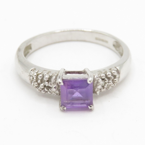 196 - 9ct white gold diamond and amethyst dress ring (2.7g) Size O