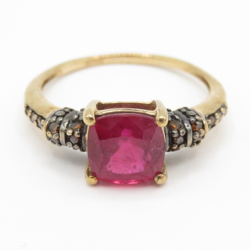 58 - 9ct gold treated ruby and colour enhanced diamond ring (2.3g) Size O