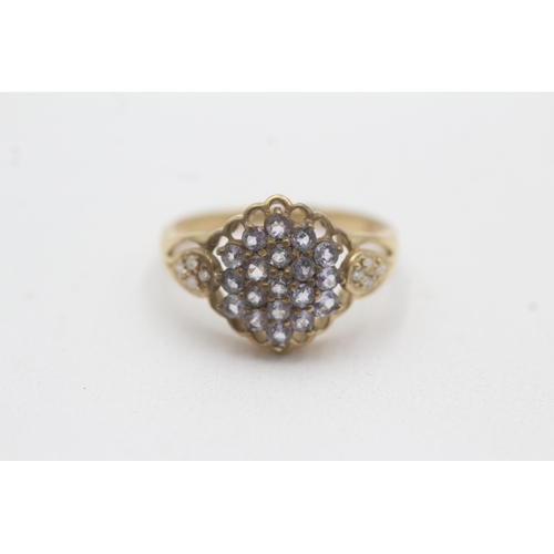 134 - 9ct gold tanzanite diamond cluster ring (2.9g) Size Q