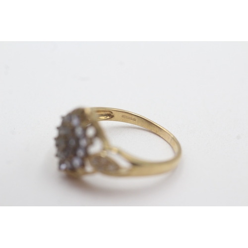 134 - 9ct gold tanzanite diamond cluster ring (2.9g) Size Q