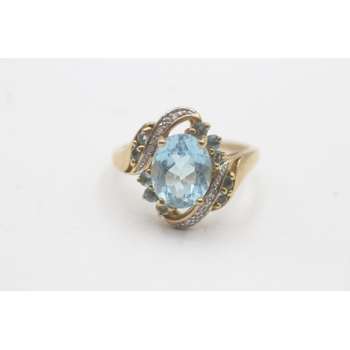 155 - 9ct gold topaz diamond cluster bypass ring (4.1g) Size P