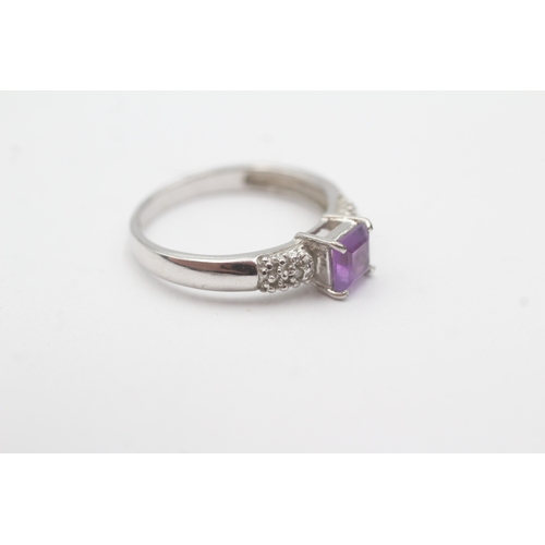 196 - 9ct white gold diamond and amethyst dress ring (2.7g) Size O
