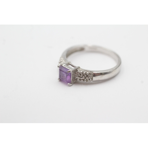 196 - 9ct white gold diamond and amethyst dress ring (2.7g) Size O