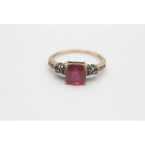 58 - 9ct gold treated ruby and colour enhanced diamond ring (2.3g) Size O