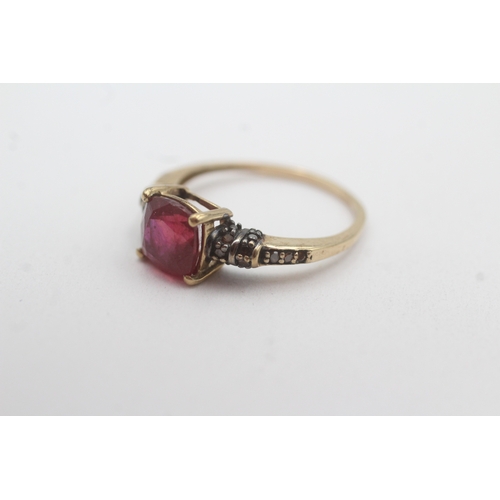 58 - 9ct gold treated ruby and colour enhanced diamond ring (2.3g) Size O