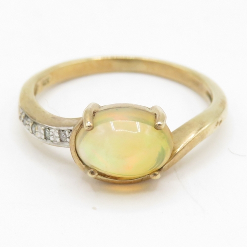 119 - 9ct gold opal and diamond dress ring (1.9g) Size L