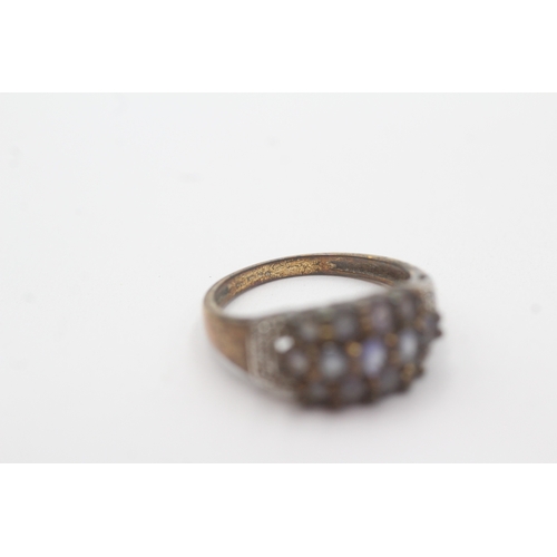 101 - 9ct gold tanzanite diamond dress ring (3.1g) Size N