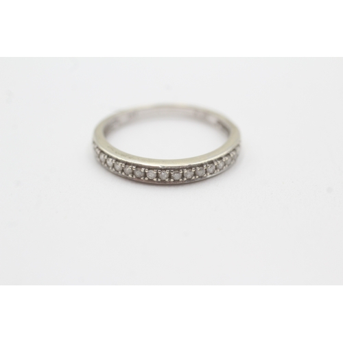 104 - 9ct white gold diamond half eternity ring (1.8g) Size O
