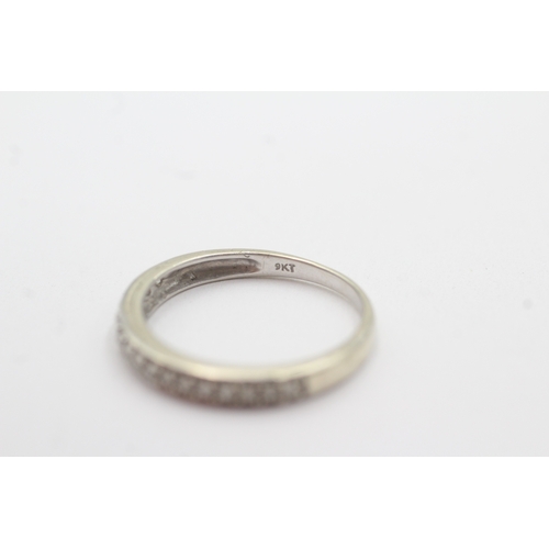 104 - 9ct white gold diamond half eternity ring (1.8g) Size O