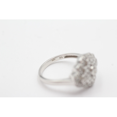 118 - 9ct white gold diamond cluster ring (4.6g) Size Q