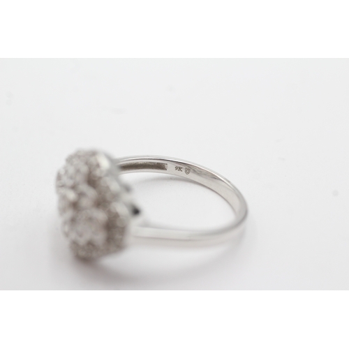 118 - 9ct white gold diamond cluster ring (4.6g) Size Q