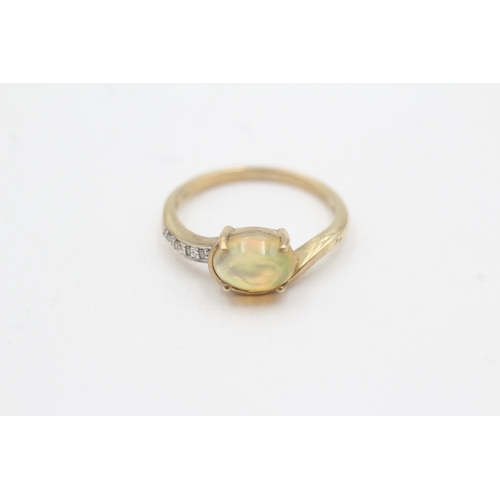 119 - 9ct gold opal and diamond dress ring (1.9g) Size L
