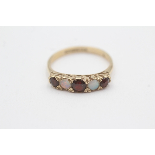 120 - 9ct gold garnet and opal five stone ring (2.4g) Size P 1/2