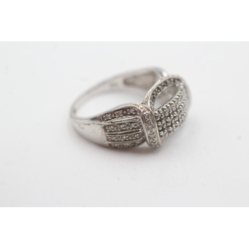 124 - 9ct white gold diamond dress ring (5.3g) Size P