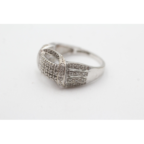 124 - 9ct white gold diamond dress ring (5.3g) Size P
