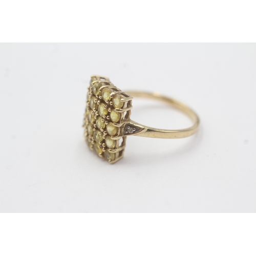 142 - 9ct gold colour enhanced yellow sapphire diamond ring (2.6g) Size N