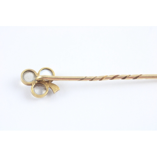 65 - 18ct gold moonstone ruby diamond stick pin (1.5g)