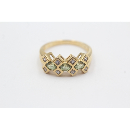 83 - 9ct gold peridot & diamond dress ring (2.8g) Size M