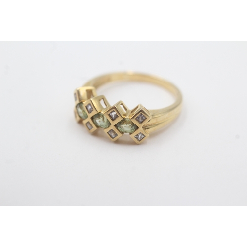 83 - 9ct gold peridot & diamond dress ring (2.8g) Size M