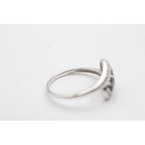 95 - 9ct white gold diamond sapphire crossover ring (1.9g) Size L