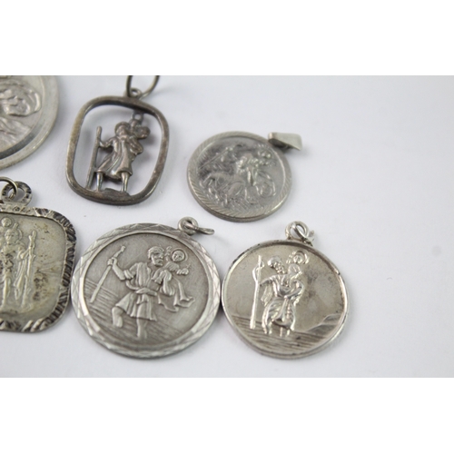170 - Collection of Sterling Silver St Christopher Pendants inc. Georg Jensen x 7 34g