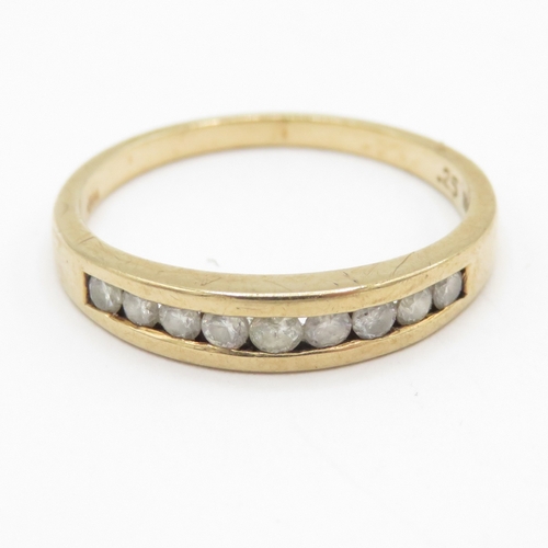 118 - 9ct gold diamond channel set half eternity ring (1.8g) Size M
