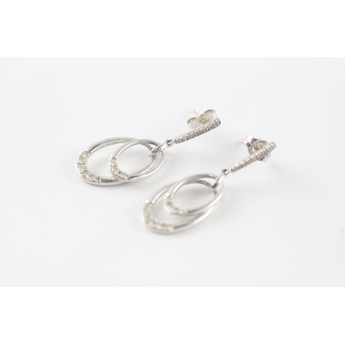 107 - 9ct white gold diamond drop earrings (3.4g)