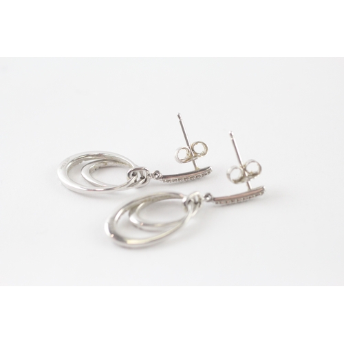 107 - 9ct white gold diamond drop earrings (3.4g)