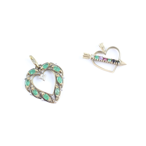 111 - 2x 9ct gold acrostic 'DEAREST' emerald diamond heart pendants (2.6g)